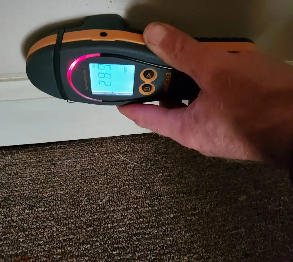 Moisture detection at baseboard during Storm Damage Restoration in Indio